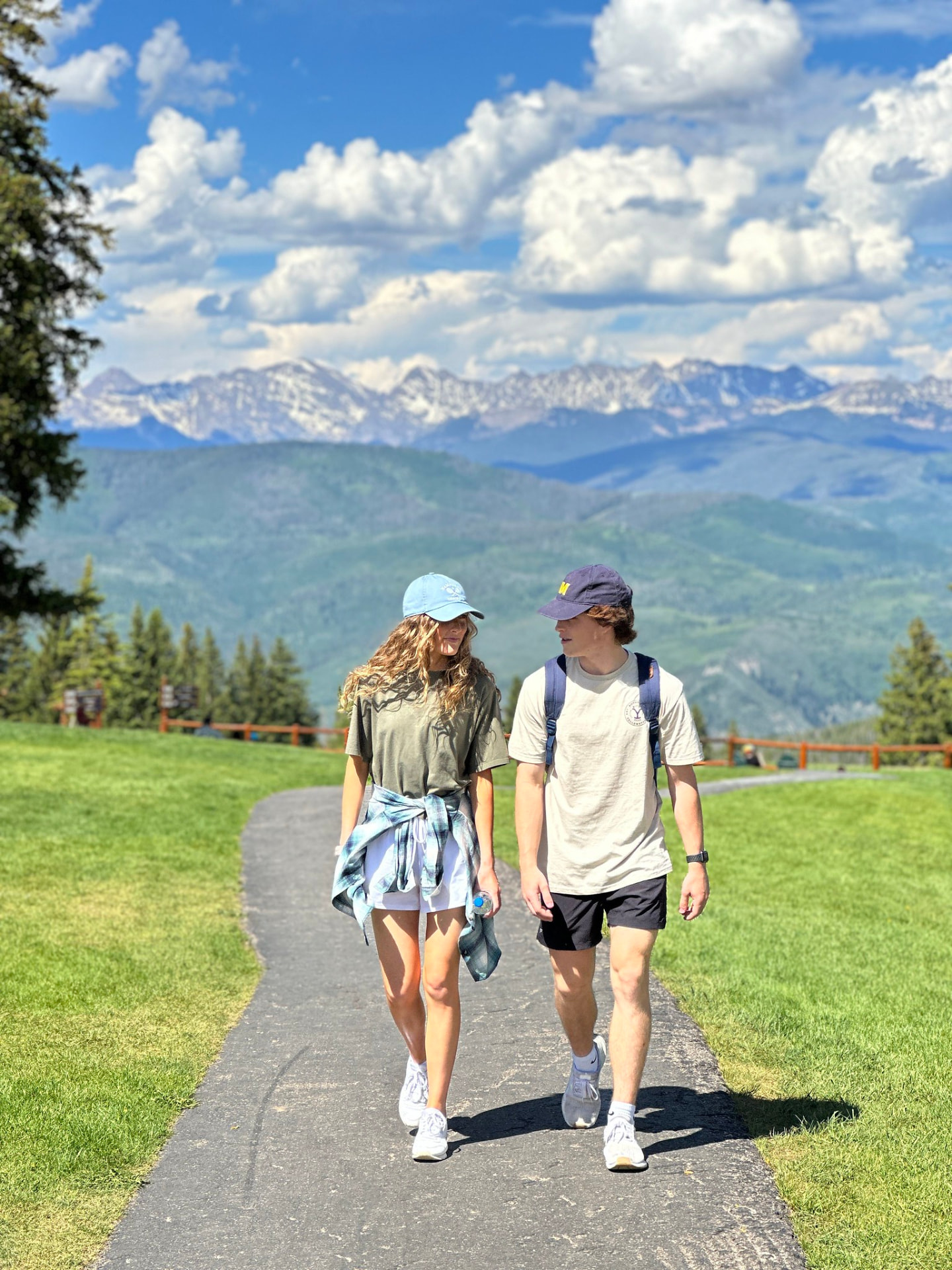 Two teenagers walking a mountain path together
