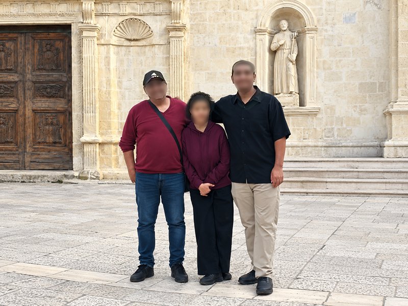 Shehab with his two children in Italy